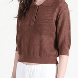 Brown shirt worn by a person, side view