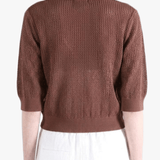 Brown shirt worn by a person, back view