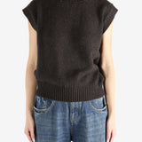 Brown tops worn by a person, showing the tops fit