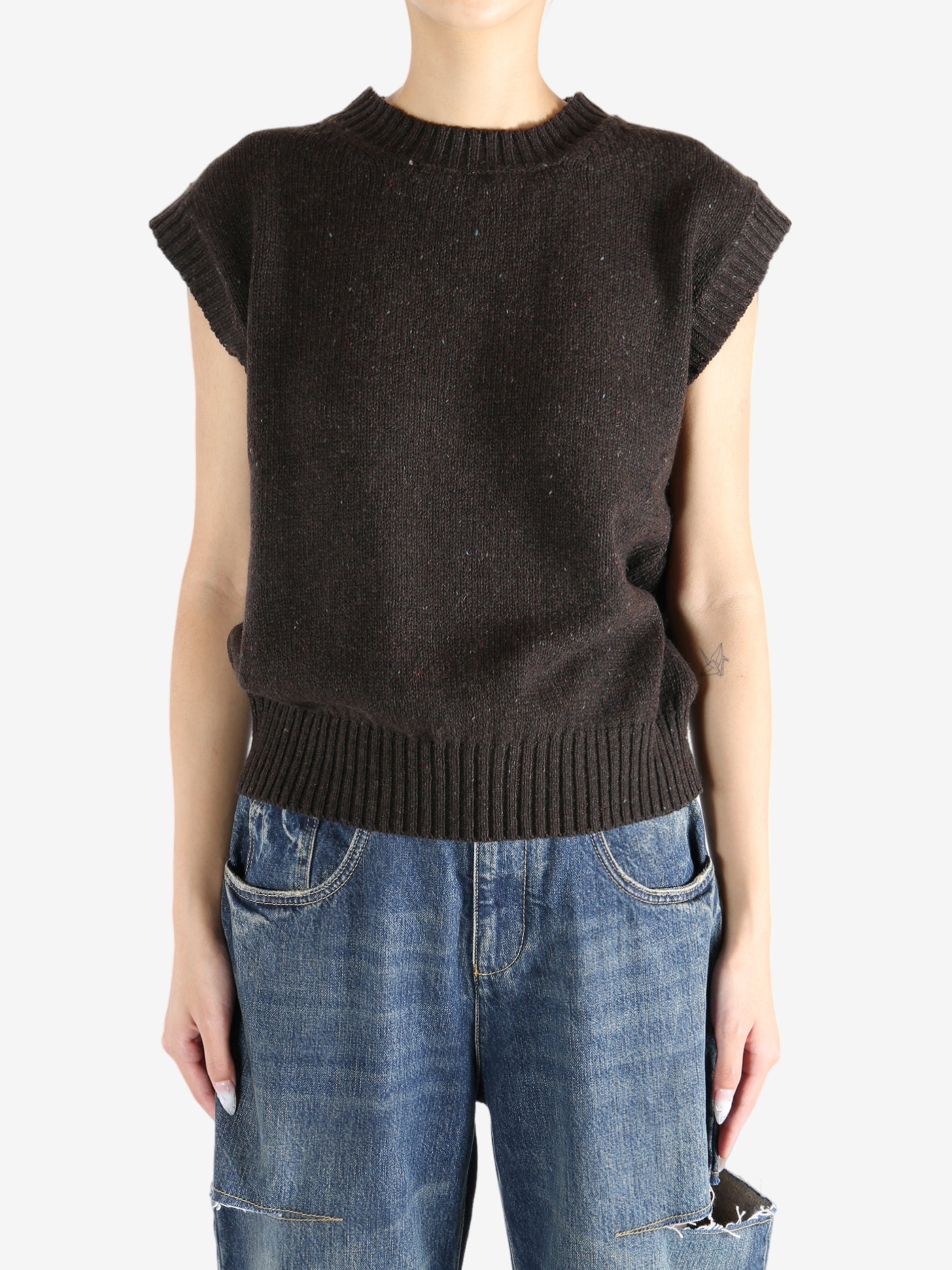 Brown tops worn by a person, showing the tops fit