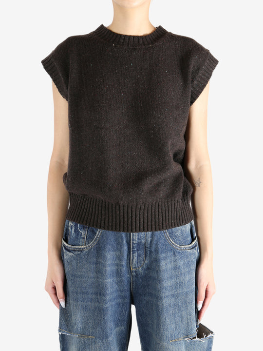 Brown tops worn by a person, showing the tops fit