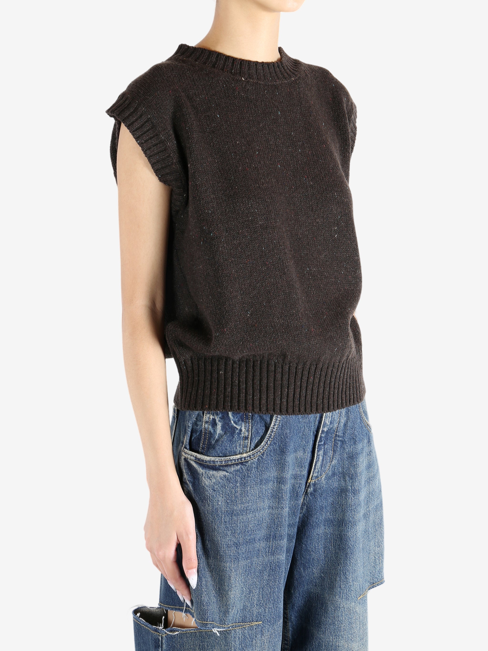 Brown tops worn by a person, showing the tops fit