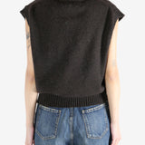 Brown tops worn by a person, showing the tops fit