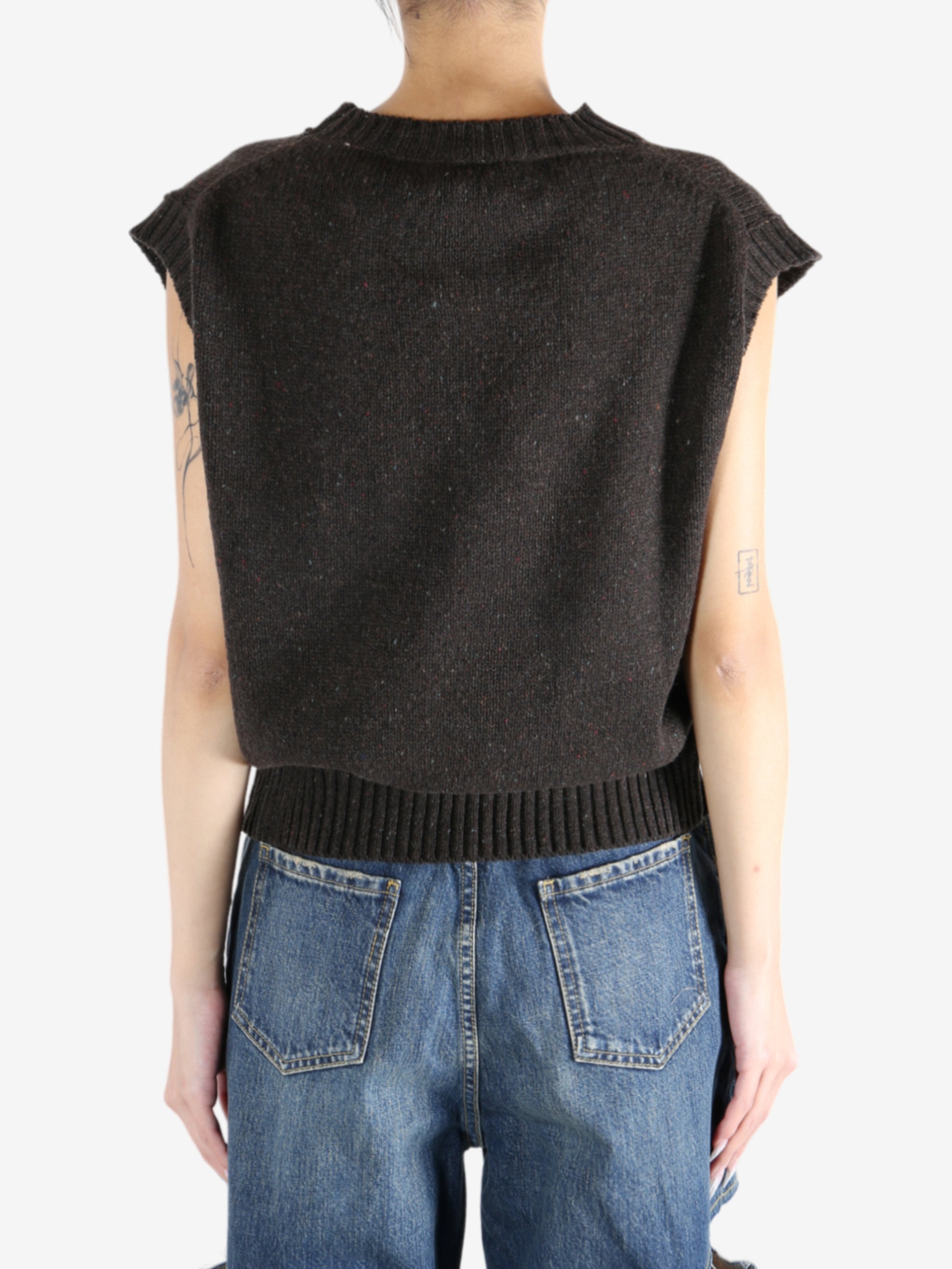 Brown tops worn by a person, showing the tops fit