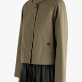 Tan jacket worn by a person, showing the jacket's fit