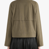 Tan jacket worn by a person, showing the jacket's fit