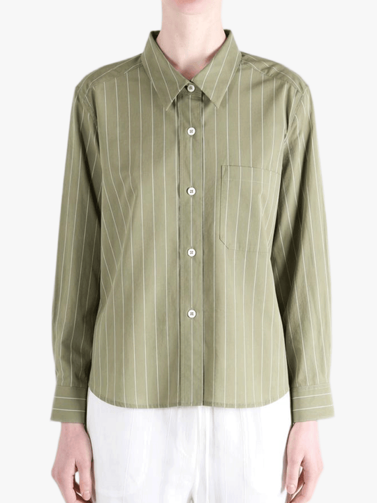 Green shirts worn by a person, showing the shirts's fit