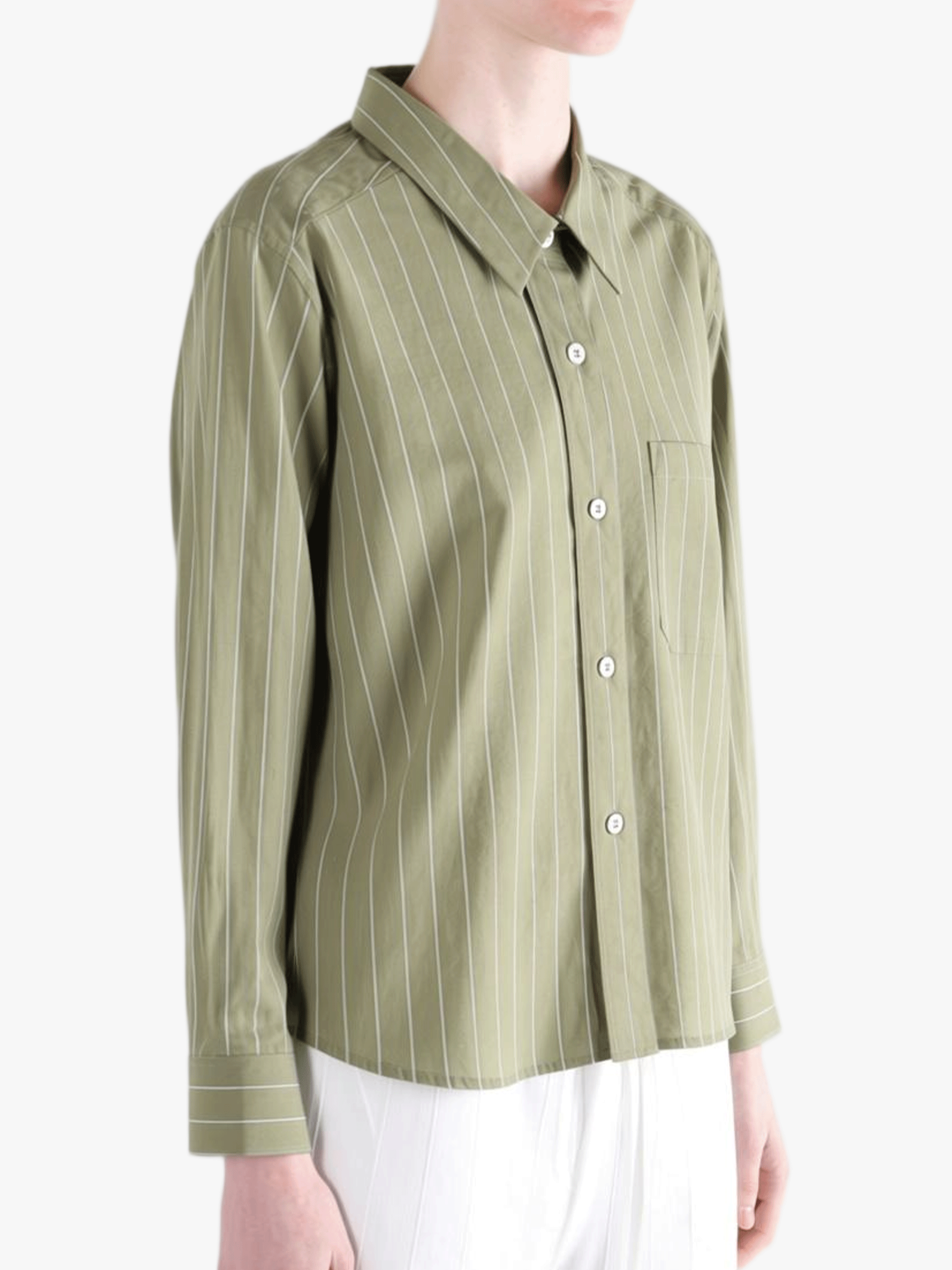Green shirts worn by a person, showing the shirts's fit
