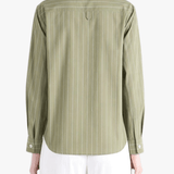 Green shirts worn by a person, showing the shirts's fit