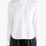 White shirt worn by a person, showing the shirt fit