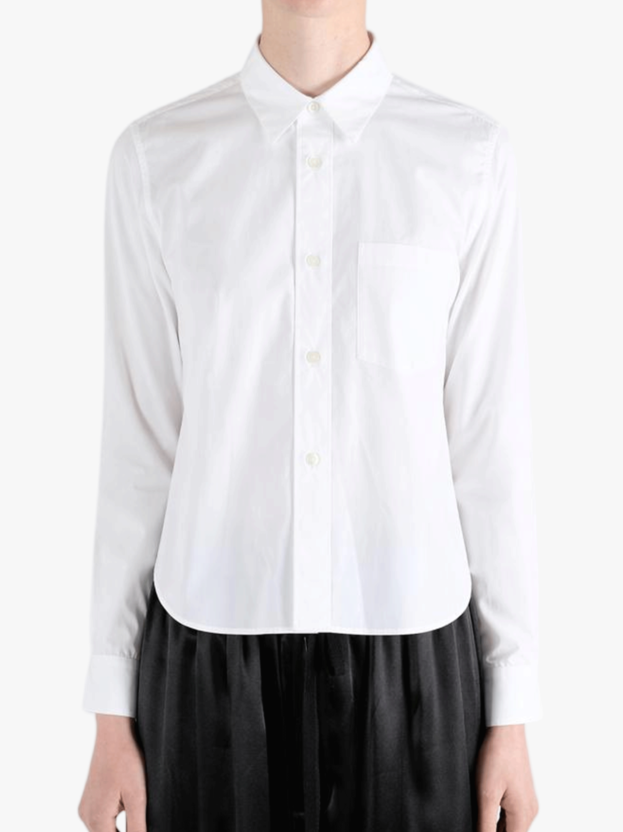 White shirt worn by a person, showing the shirt fit