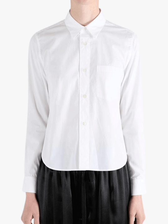 White shirt worn by a person, showing the shirt fit