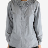 grey shirts worn by a person, showing the shirts fit