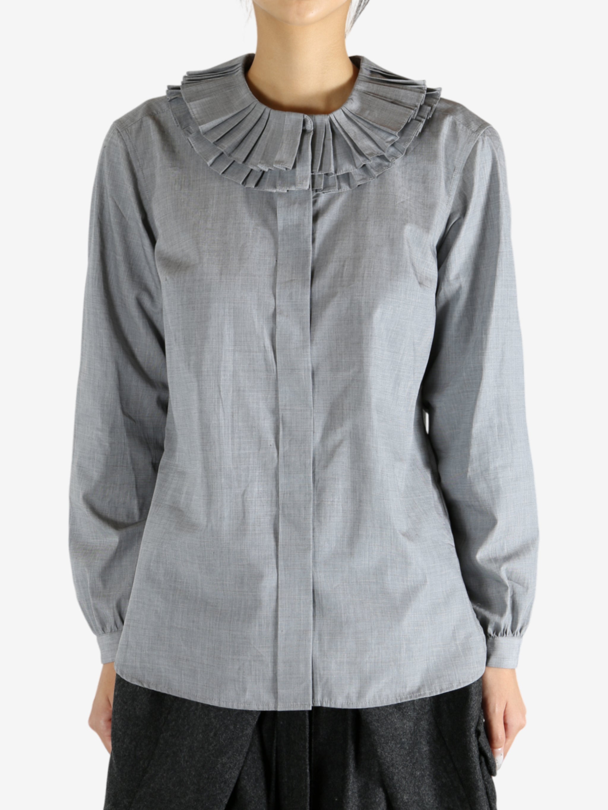 grey shirts worn by a person, showing the shirts fit