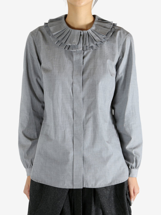 grey shirts worn by a person, showing the shirts fit