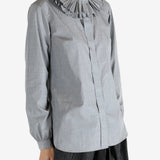 grey shirts worn by a person, showing the shirts fit