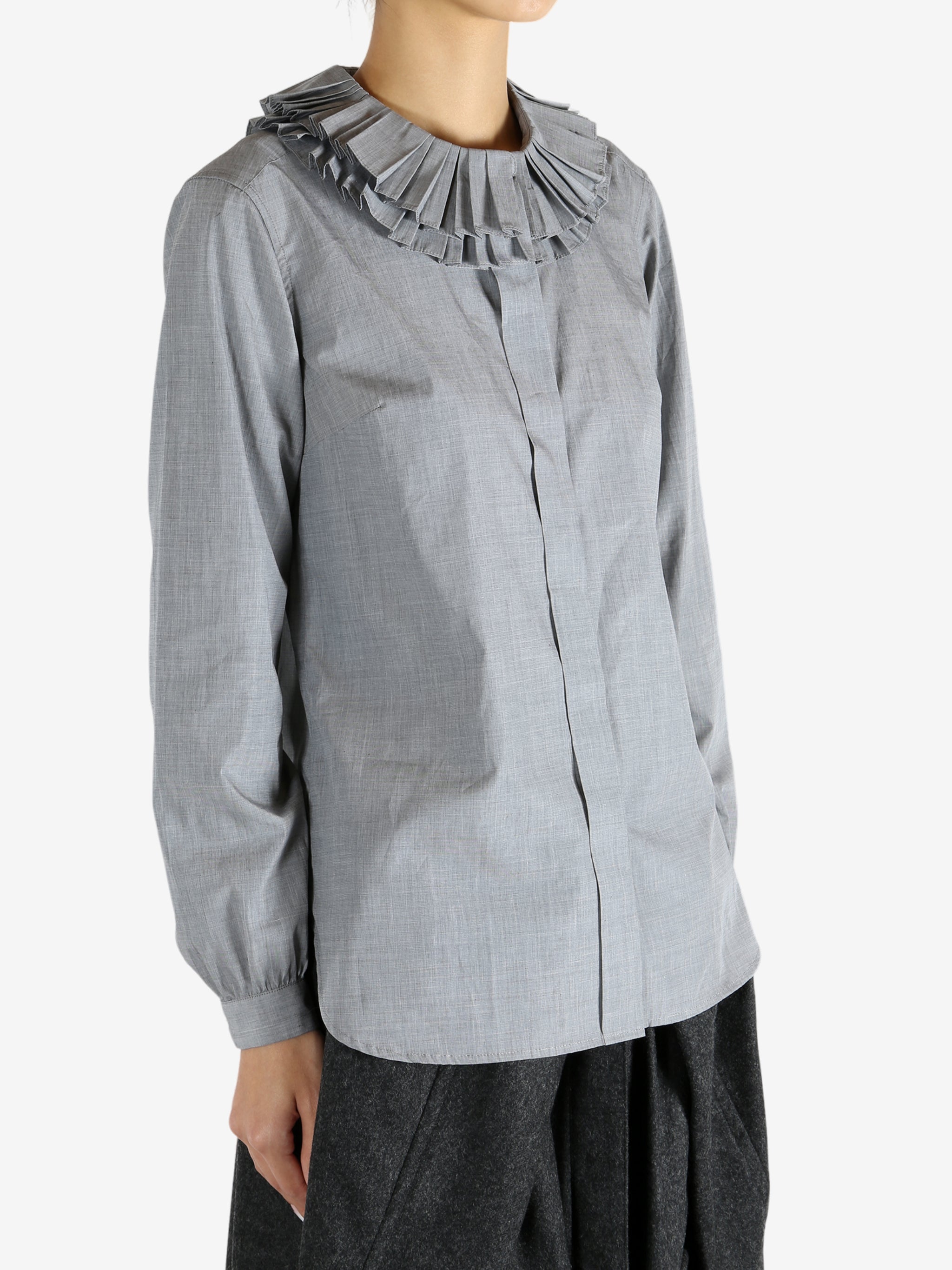 grey shirts worn by a person, showing the shirts fit