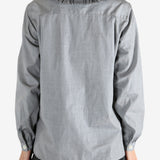 grey shirts worn by a person, showing the shirts fit