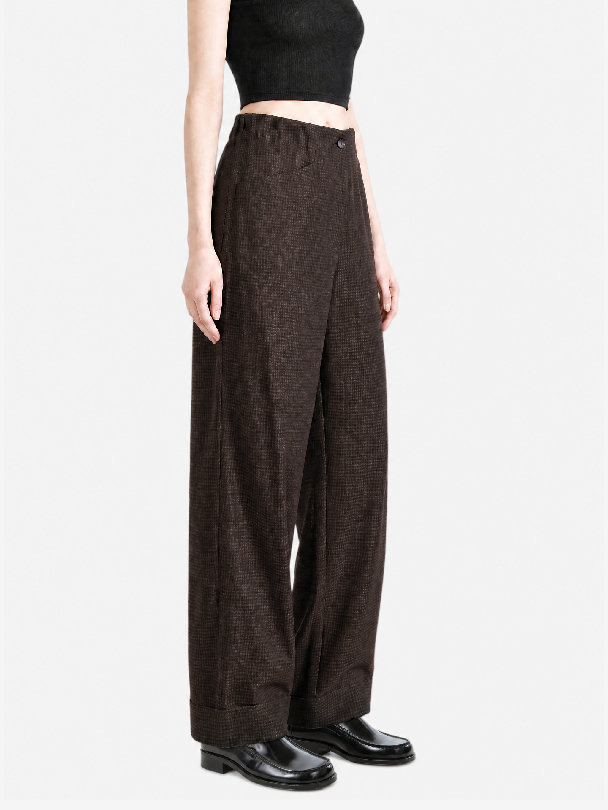 Brown pants worn by a person, showing the pants fit