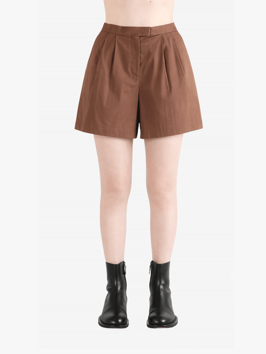 Brown shorts worn by a person, showing the shorts fit