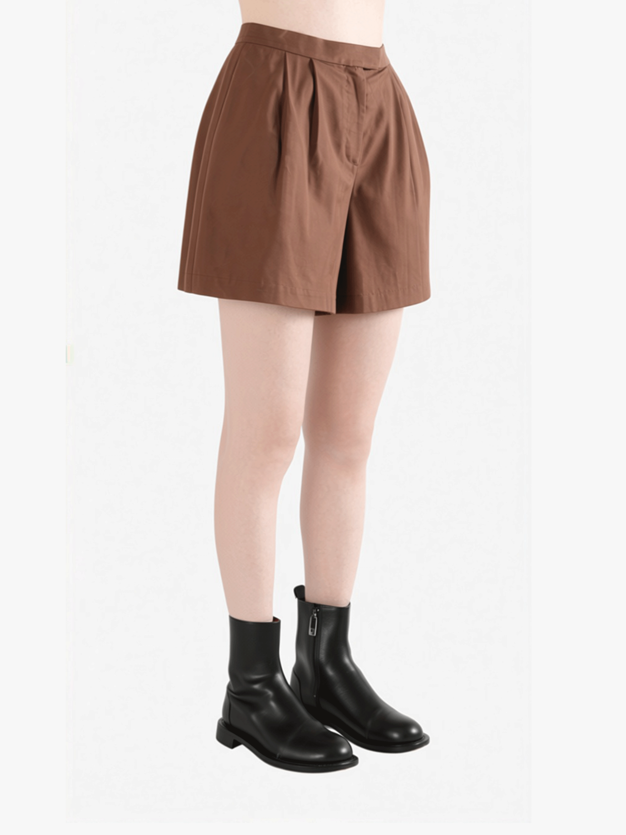 Brown shorts worn by a person, side view