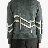  gray sweater worn by a person, showing the sweater  fit