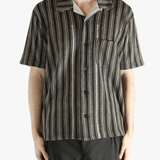 Grey shirt worn by a person, showing the shirt's fit
