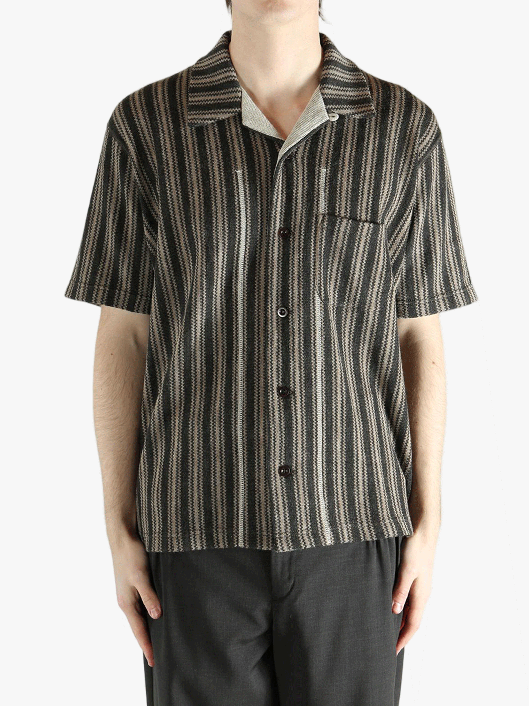 Grey shirt worn by a person, showing the shirt's fit