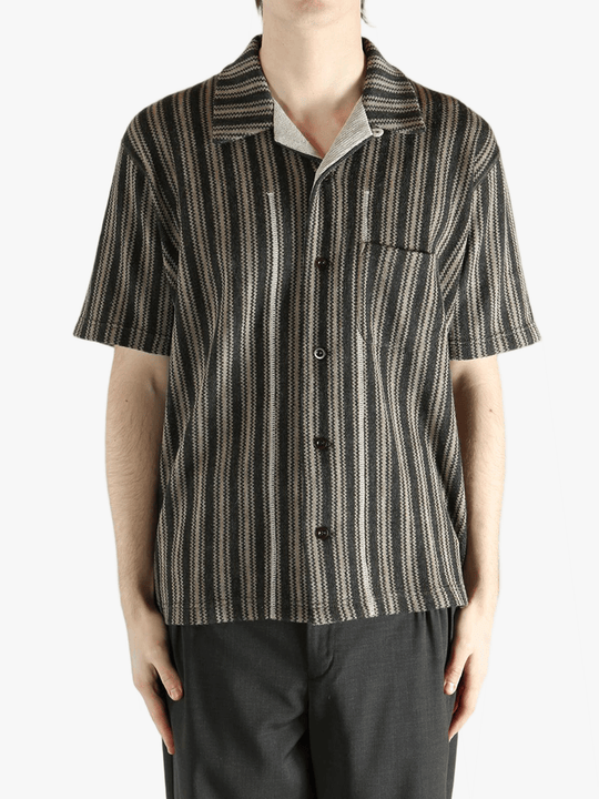 Grey shirt worn by a person, showing the shirt's fit