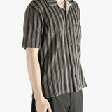 Grey shirt worn by a person, showing the shirt's fit