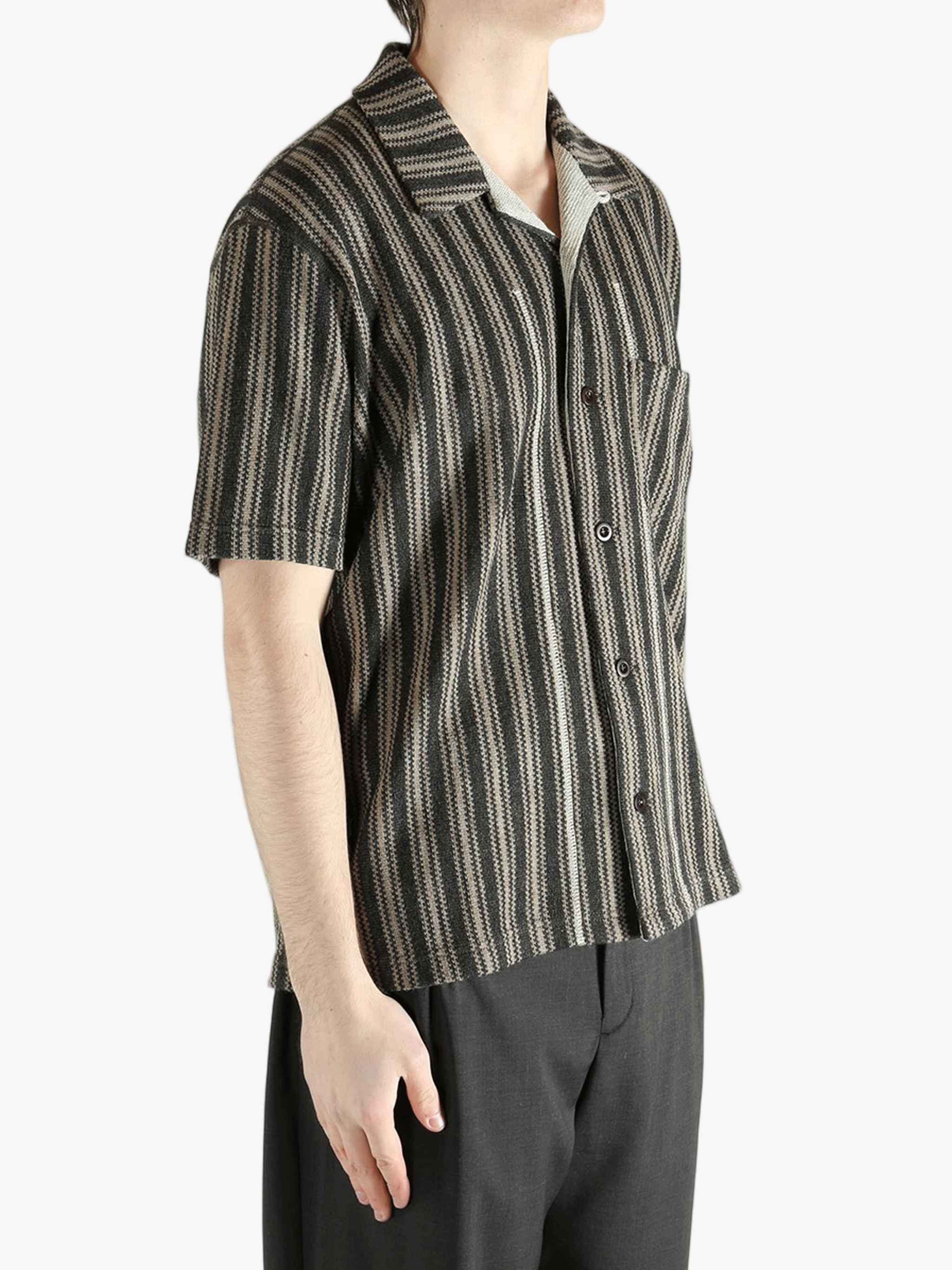 Grey shirt worn by a person, showing the shirt's fit