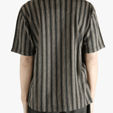 Grey shirt worn by a person, showing the shirt's fit