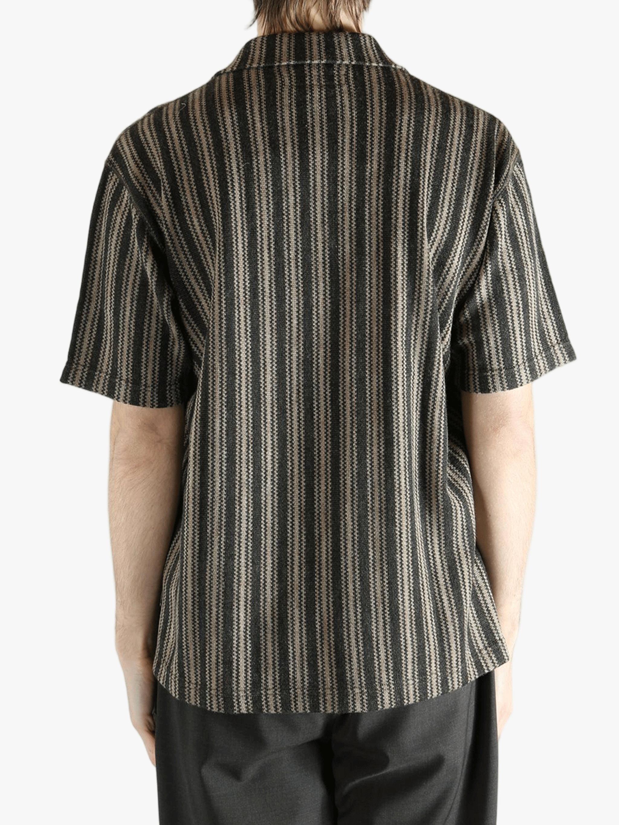 Grey shirt worn by a person, showing the shirt's fit