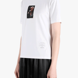 White t-shirt worn by a person, showing the t-shirt fit
