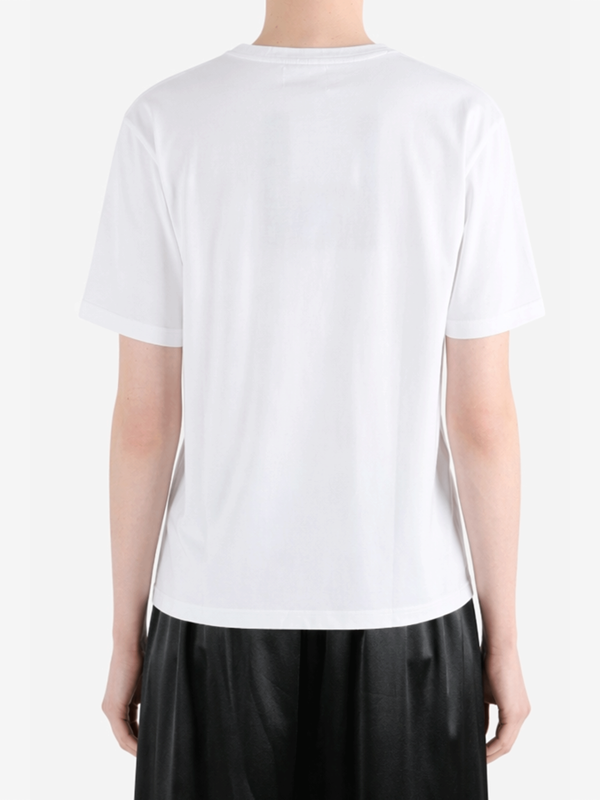 White t-shirt worn by a person, showing the t-shirt fit
