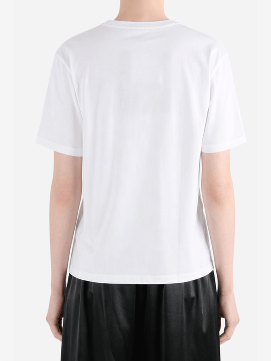 White t-shirt worn by a person, showing the t-shirt fit