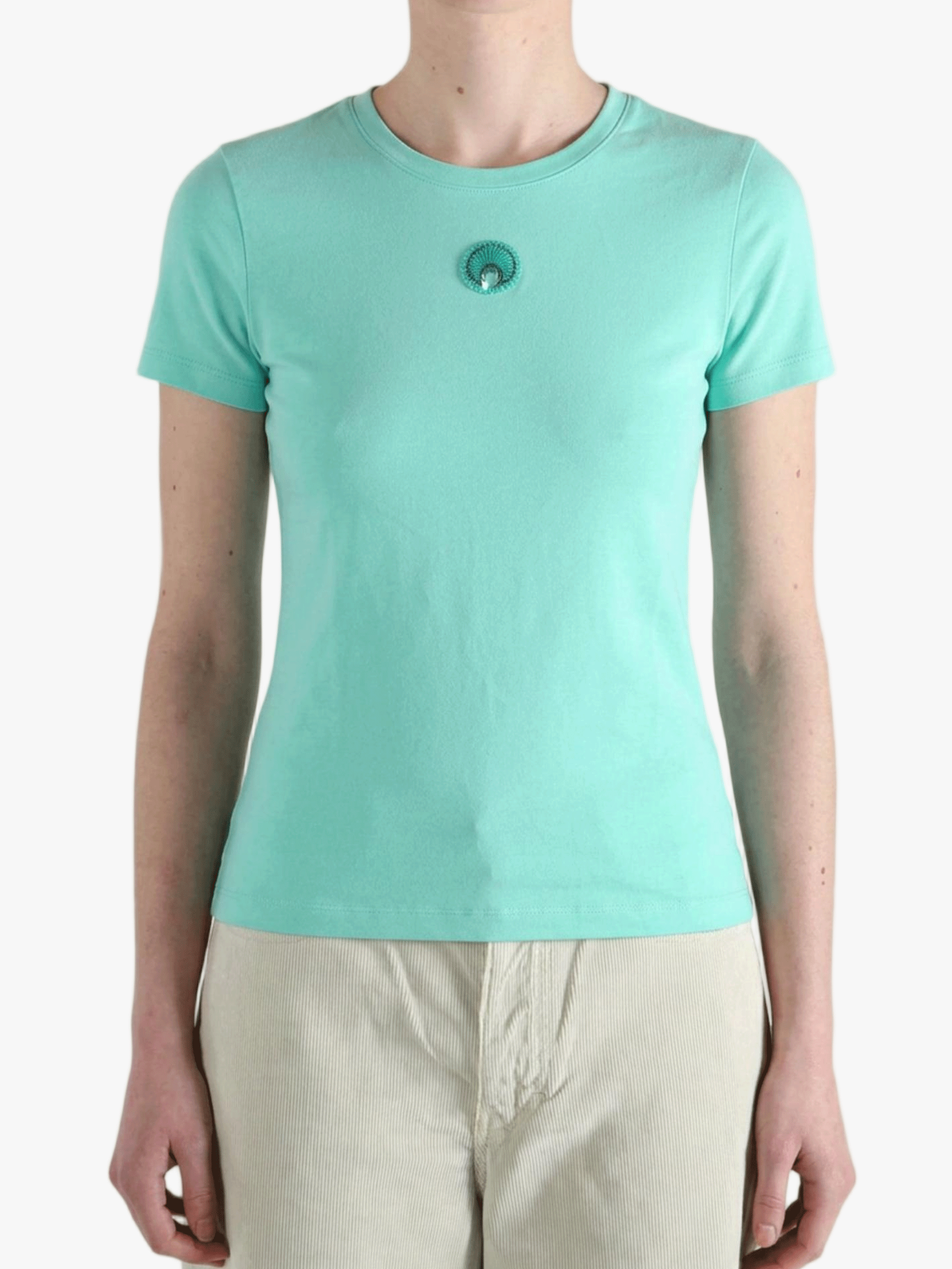 Green t-shirt worn by a person, showing the t-shirt fit