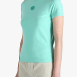Green t-shirt worn by a person, side view