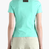 Green t-shirt worn by a person, back view
