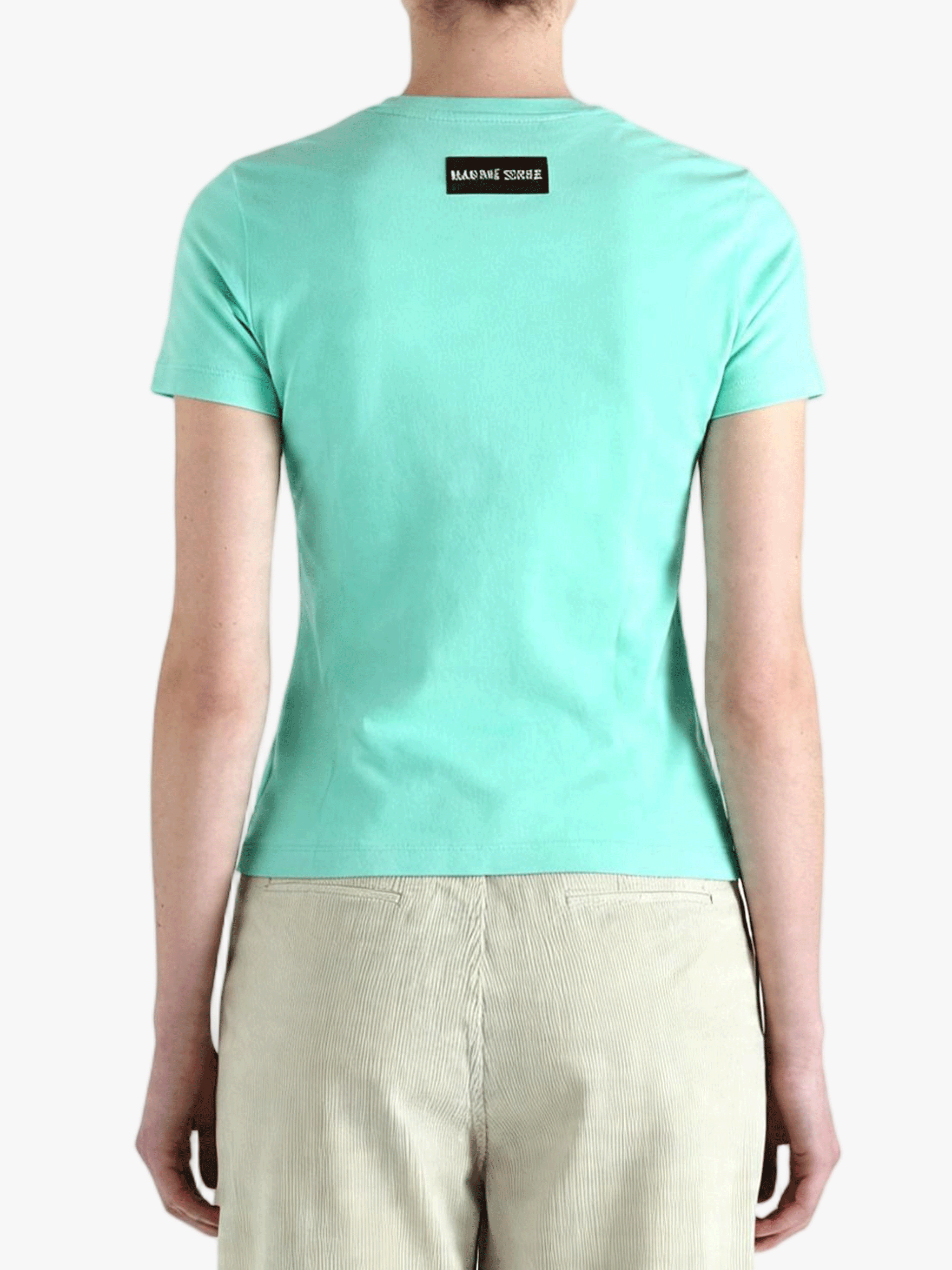 Green t-shirt worn by a person, back view