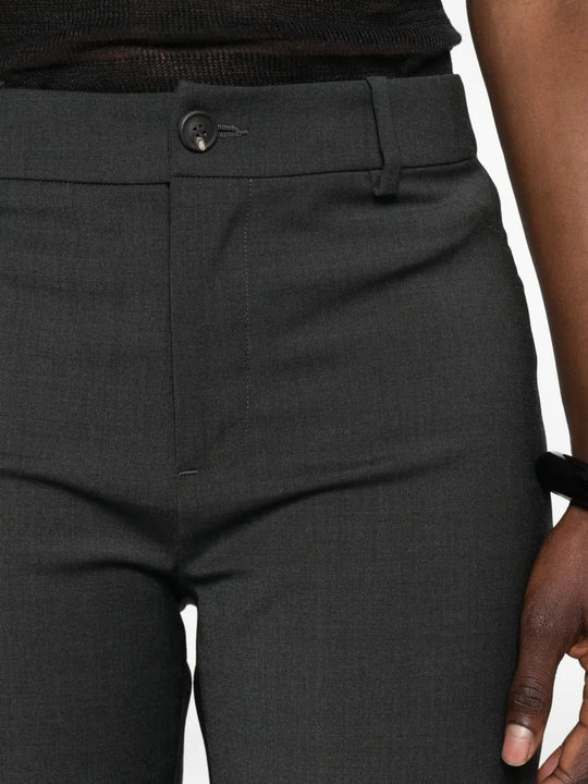 Grey shorts worn by a person, showing the shorts fit