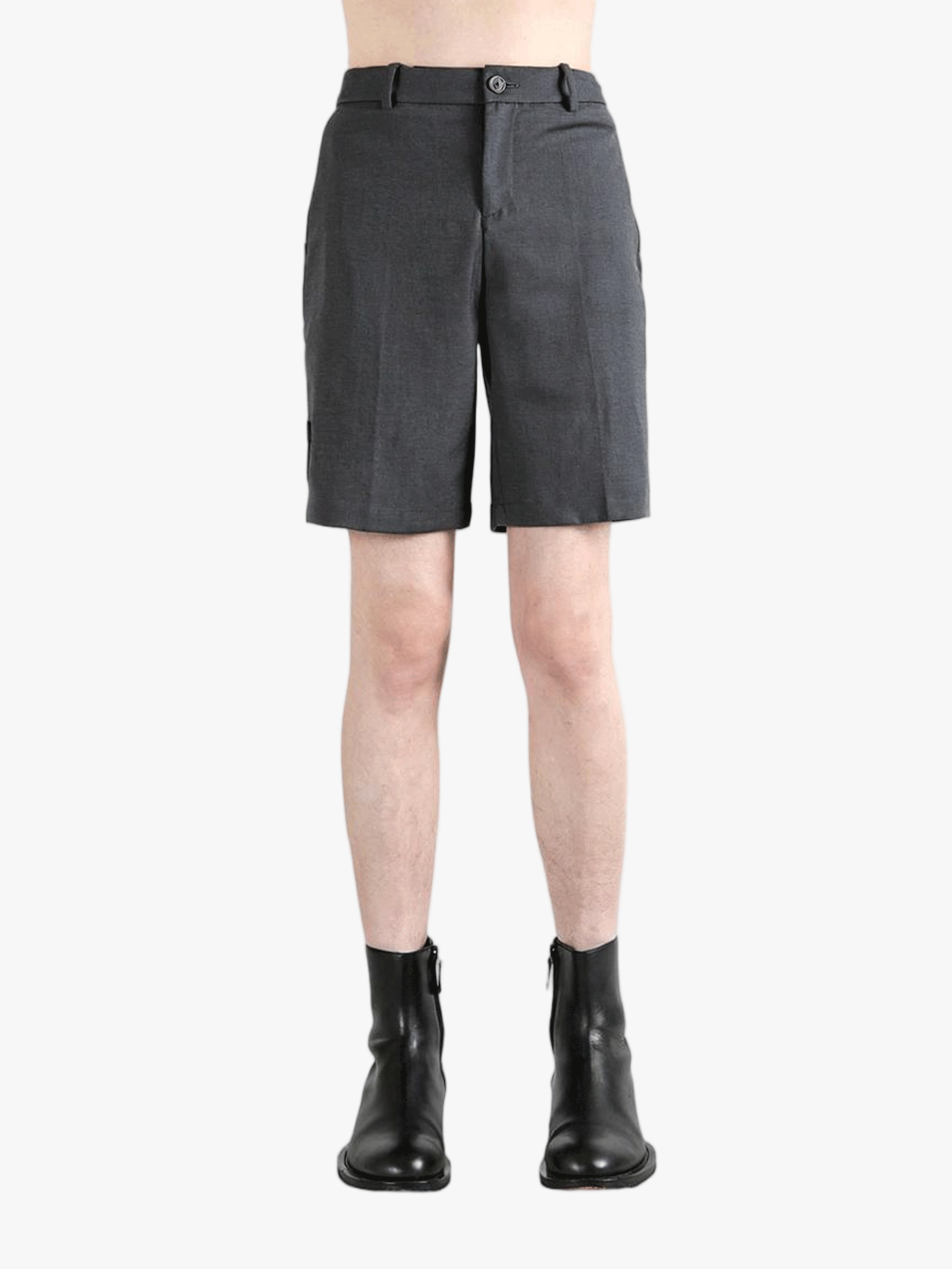 Grey pants worn by a person, showing the pants fit