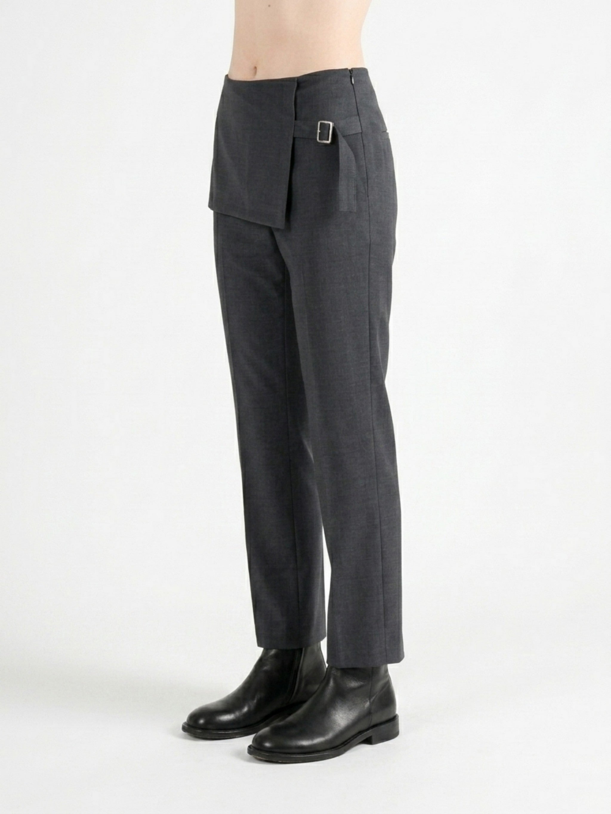 Grey pants worn by a person, side view