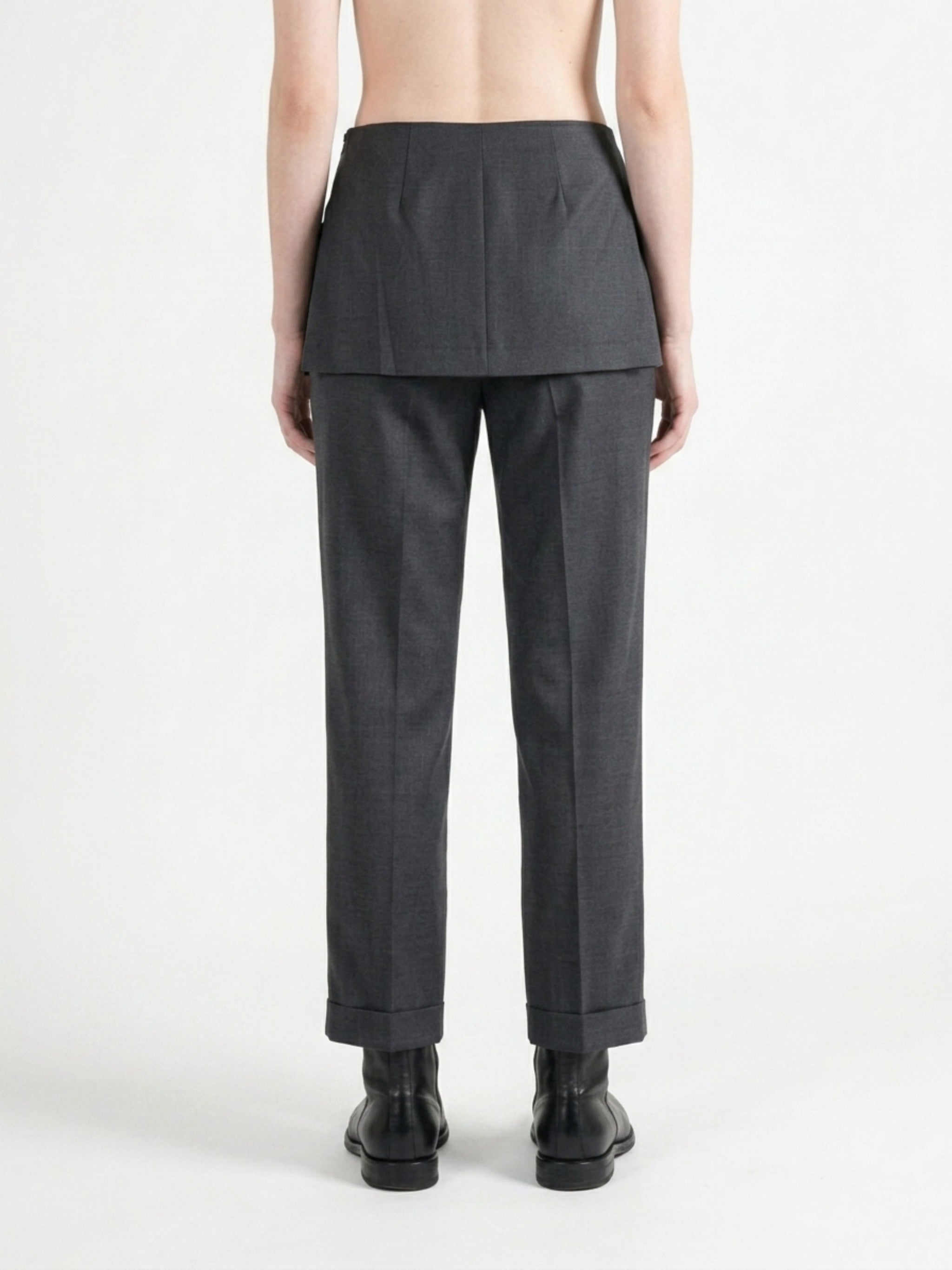 Grey pants worn by a person, back view