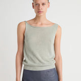 Green top worn by a person, showing the top's fit