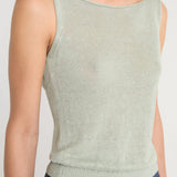 Green top worn by a person, showing the top's fit