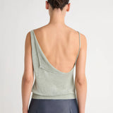 Green top worn by a person, showing the top's fit