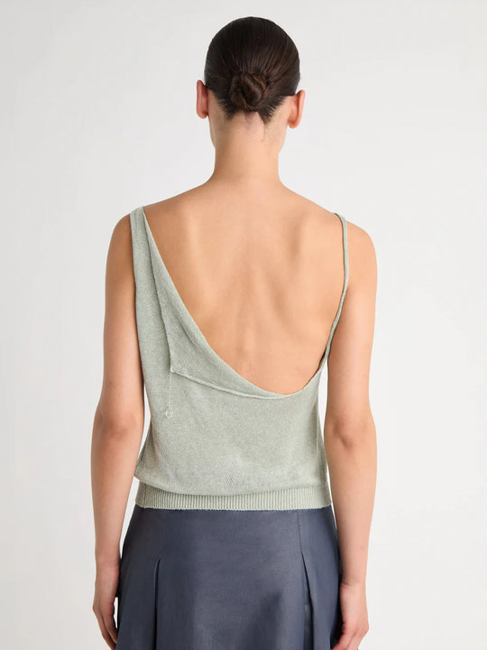 Green top worn by a person, showing the top's fit