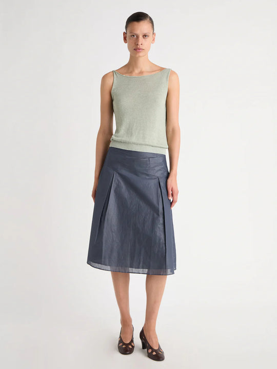 Green top worn by a person, showing the top's fit