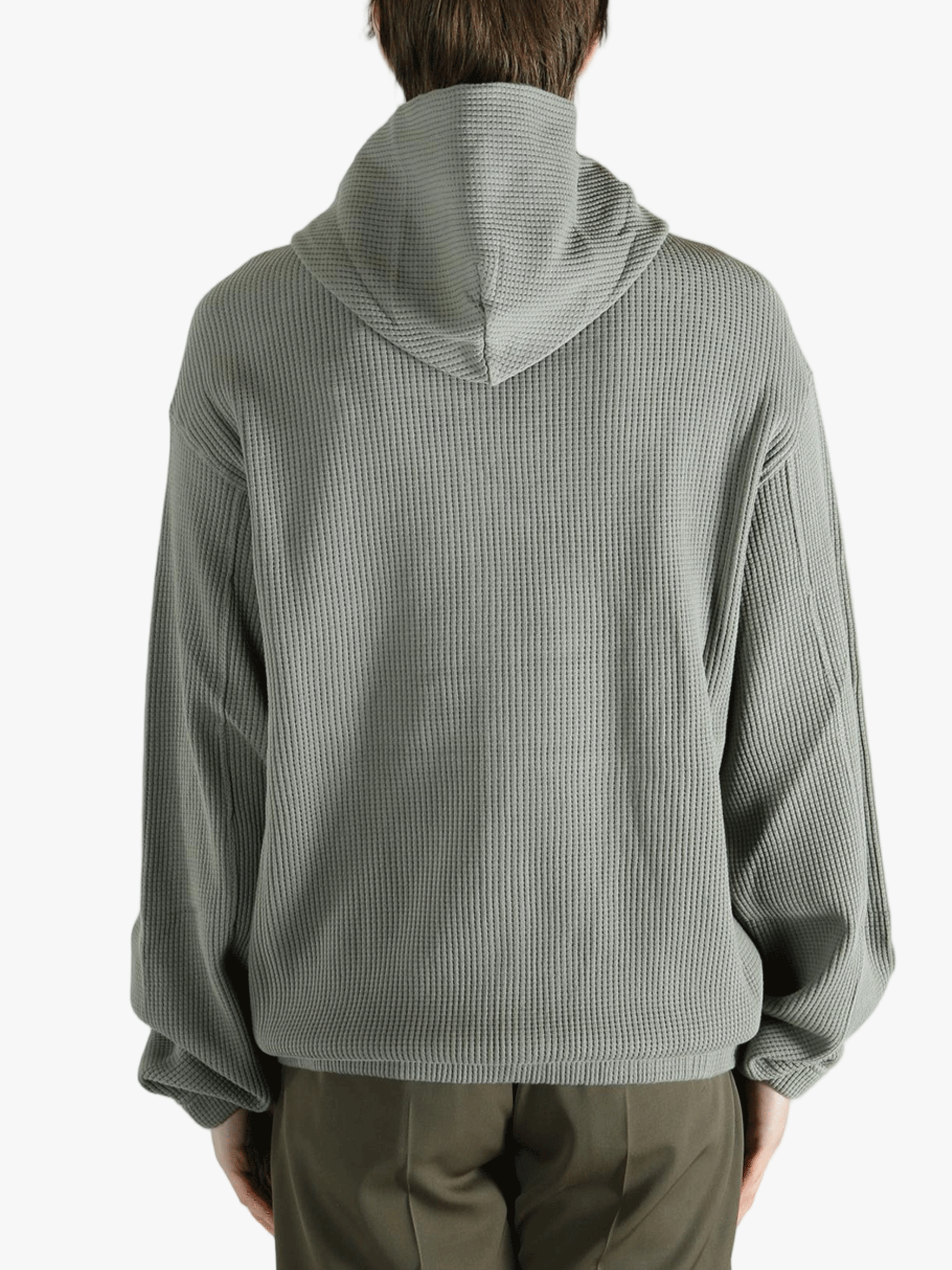 Grey hoodie worn by a person, showing the hoodie's fit